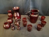 Pigeon blood pitcher, six tumblers, cruet, salt and pepper shakers, vases