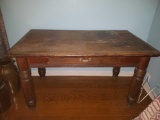 Oak one drawer library table with column legs and casters