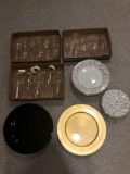 Pier 1 gold swirl plates and stemware, gold and black plastic plates