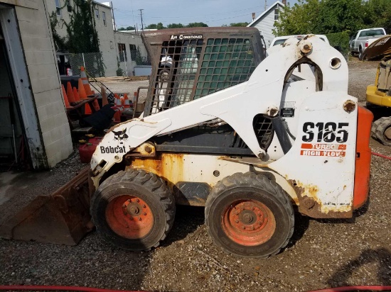 Bobcat S185 skid steer, diesel, and material bucket, 2,216 hours, spare tire