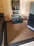 Shelf, trunk, decor pieces, area rug