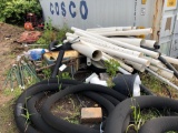 Large pile of PVC, drain tile, T posts