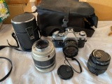 Canon AE-1 35 mm camera, Hoya 52 mm lens, damaged AF 28-300 mm macro lens