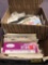 Box of loose postage stamp and stack of envelopes and first day covers