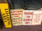 No parking signs and authorized parking signs and loading area wooden sign