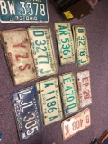 17 vintage license plates, mostly pairs