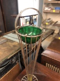 Brass stand with green glass bowl