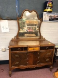 Ornate wooden dresser with mirror