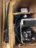 Box of various wires cables and power cords and serving dishes