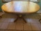 Oak pedestal dining table w/ one leaf, 5' long w/ leaf x 42