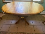 Oak pedestal dining table w/ one leaf, 5' long w/ leaf x 42