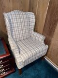 Plaid wing back chair with wicker ottoman
