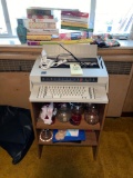 IBM electric typewriter, cookbooks, vases