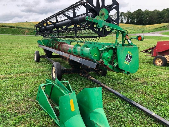 JD 925 Flex head pipe reel fore and aft. good poly skids with like new 25' J & M header cart