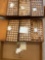 Small watch parts in about 9 wooden boxes