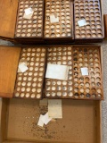 Small watch parts in about 9 wooden boxes