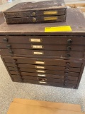 3 metal cabinets loaded with wrist watch crystals