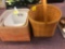 The company store three orange woven containers and one large Longaberger basket with handle