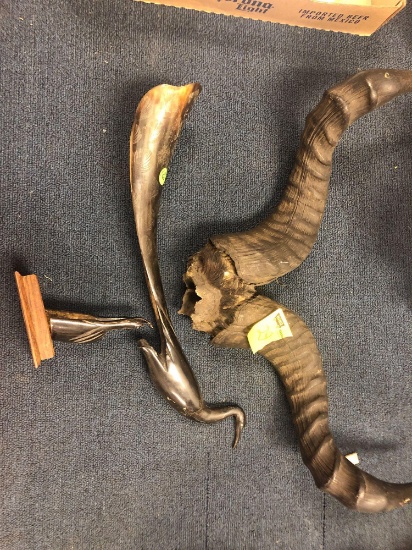 Ram horns and carved bird needing repair