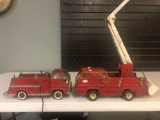 2 Tonka fire trucks and box of plastic houses