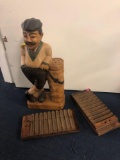Wooden golf statue and cigar mold and metal sailboat wall art and etc.