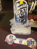 Milwaukee?s best ice beer metal sign and Miller light NFL metal sign