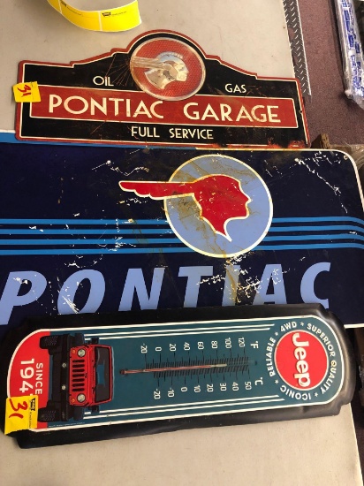 Pontiac metal signs and Jeep thermometer