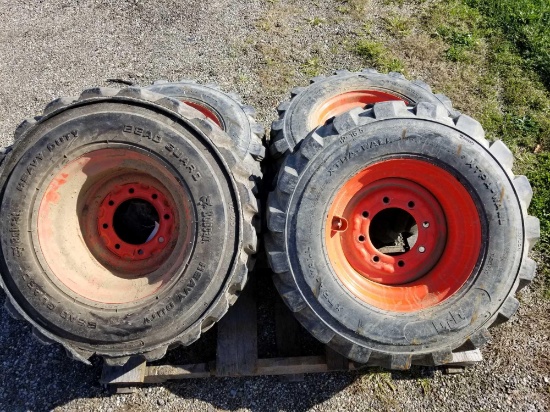 Set of 4 skid loader tires and rims, 12-16.5 xtra wall