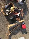 Garden tractor parts, electric heater, sledgehammer, splitting wedge, gas can.