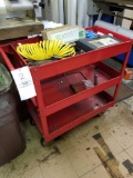 Red tool cart with tools