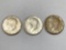 (3) 1964 Kennedy silver half dollars.