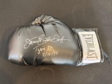 Buster Douglas signed boxing glove (Tyson KO 2/10/90). VS Autograph COA #A15291.