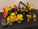 (4) Tonka toy earth moving machines.