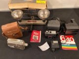 Bell & Howell light bar, Kodak Reliant movie camera (rough), (2) Polaroid cameras