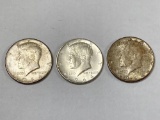 (3) 1964 Kennedy silver half dollars.