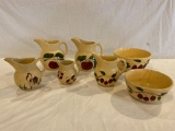 (7) Pcs. Watt Ware. Hairline cracks on bowls, (2) apple pitchers have small chips on spouts