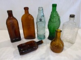 (7) Bottles: Warner's Safe Cure, Elnewsome's mineral water, Lincoln Inn, fish scene, etc.