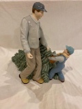 Unmarked made in China dad & son dragging Christmas tree, 13