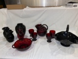 Red glass pitcher w/ (4) tumblers, red & black glass vases, black porcelain basket.