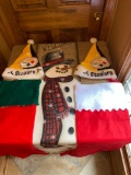 Christmas stockings, Pittsburgh Steelers holiday caps, Welcome snowman banner.