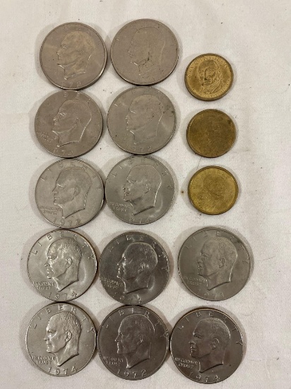 (12) 1971-1974 Eisenhower silver dollars, (2) 2000P Sacagewea dollars