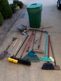 Garbage can, garden tools.