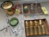 Ice buckets, cork screws, bottle openers, cocktail glasses, eagle decorated glass carafe, ashtray.