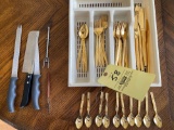 Golden Bouquet flatware set serves 8 but only (7) spoons, (9) Gold colored small spoons, knives.