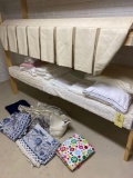 Towels, bedding, drape, rugs.