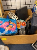 Miscellaneous box of purses, thermos, paper towel holder, Pioneer Woman cake stand, pool float, art