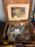 Basket full of vintage postcards and photos