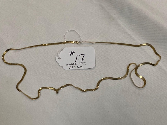 Marked 10K gold 32" long necklace, twisted damage.