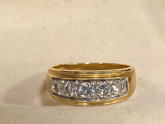 Man's 14K yellow gold ring w/ (5) diamonds.