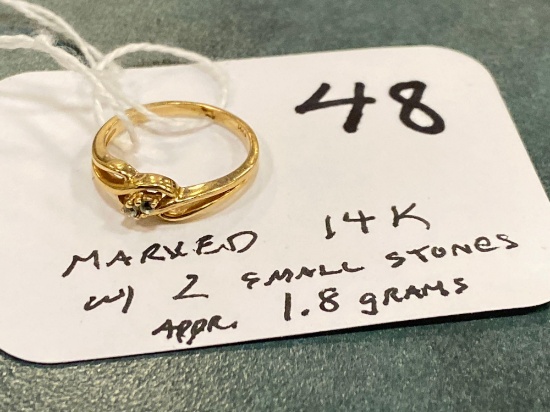 Marked 14K ring w/ two small stones, 1.8 grams approximately.